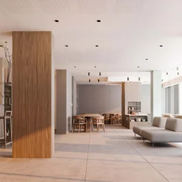 Sala moderna con tavoli in legno e divano grigio chiaro